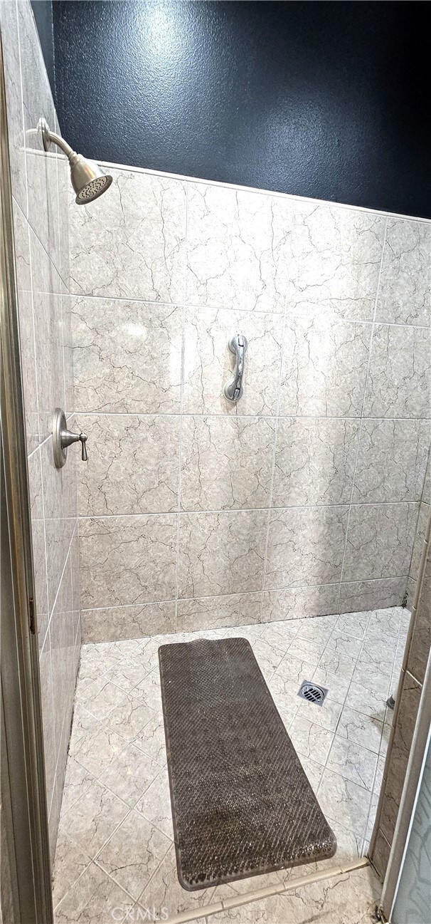 7445 Cedar St, Phelan, CA 92371 - bathroom featuring a stall shower