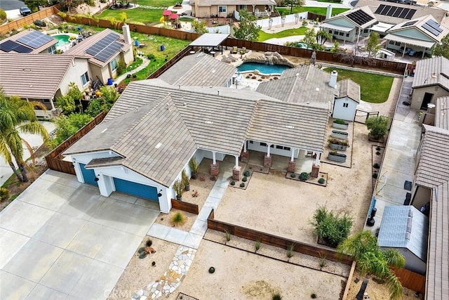 birds eye view of property with a residential view
