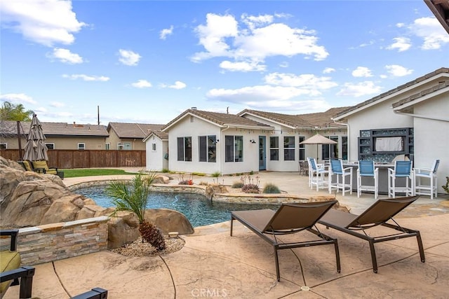 view of pool with fence, a fenced in pool, and a patio