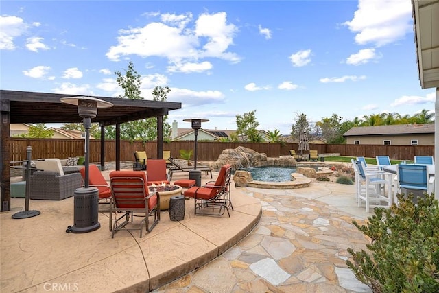 view of patio / terrace with an outdoor fire pit and a fenced backyard