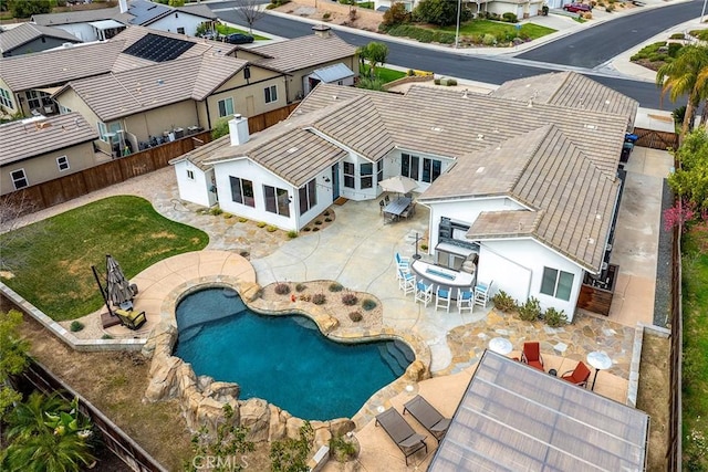 birds eye view of property with a residential view