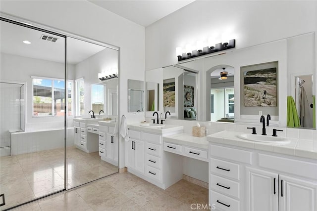full bath featuring visible vents, a shower, a ceiling fan, vanity, and a bathtub