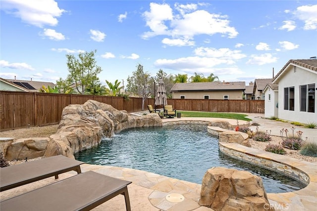 view of pool featuring a patio, a fenced backyard, and a fenced in pool
