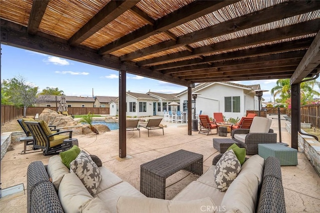 view of patio / terrace featuring a fenced backyard, a fenced in pool, and an outdoor hangout area