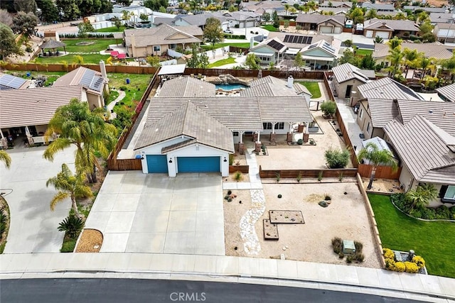 birds eye view of property with a residential view