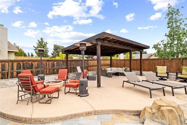 view of patio featuring an outdoor living space with a fire pit and a fenced backyard