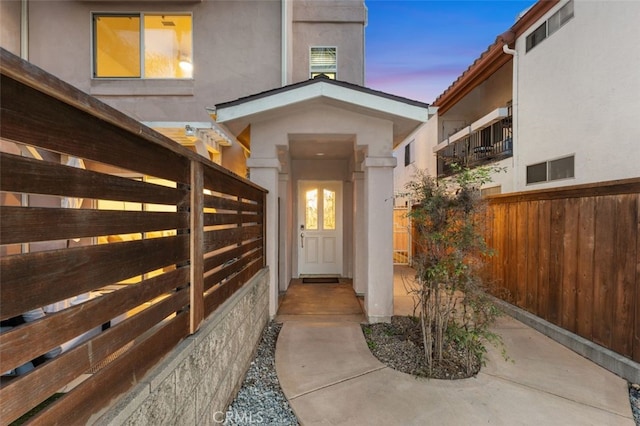 1517 Felspar St, San Diego, CA 92109 - exterior entry at dusk with stucco siding