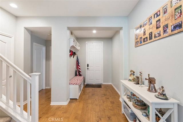 33734 Wild Horse Way, Yucaipa, CA 92399 - entrance foyer with stairs, light wood finished floors, recessed lighting, and baseboards