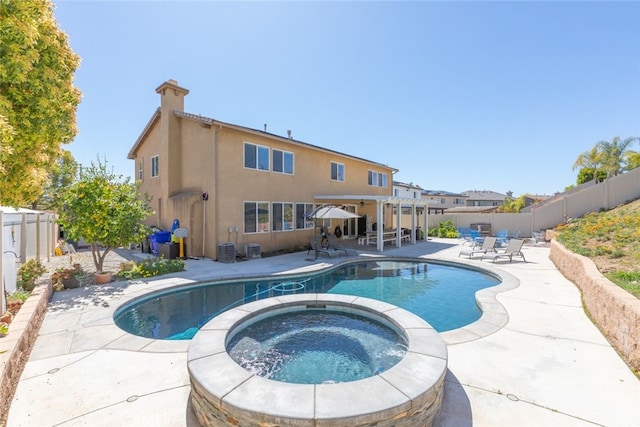 33734 Wild Horse Way, Yucaipa, CA 92399 - view of pool featuring a fenced backyard, a patio area, a pool with connected hot tub, and central air condition unit