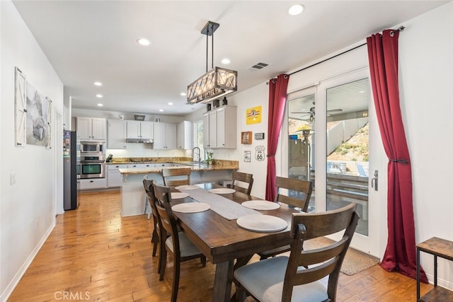 33734 Wild Horse Way, Yucaipa, CA 92399 - dining room with light wood-style floors, recessed lighting, and baseboards