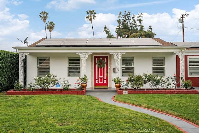 915 S Danehurst Ave, Glendora, CA 91740 - view of front of house with a porch, a front yard, roof mounted solar panels, and stucco siding
