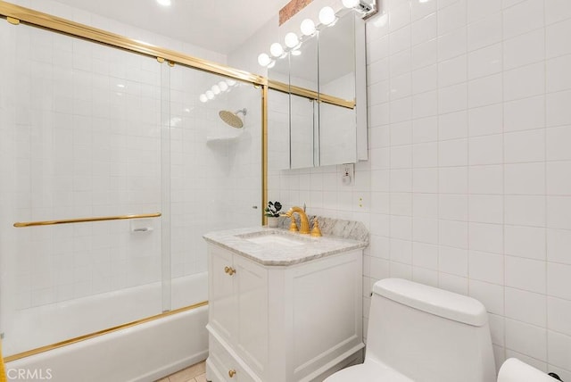 915 S Danehurst Ave, Glendora, CA 91740 - full bath with toilet, vanity, bath / shower combo with glass door, and tile walls