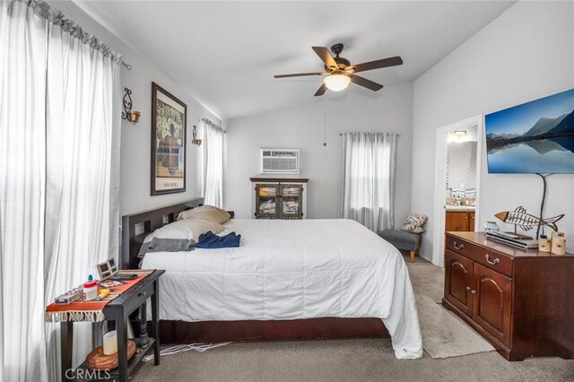 7160 Bel Air St, Corona, CA 92881 - bedroom with light colored carpet, vaulted ceiling, a wall mounted air conditioner, a ceiling fan, and connected bathroom
