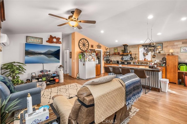 7160 Bel Air St, Corona, CA 92881 - living area with vaulted ceiling, a ceiling fan, light wood-style flooring, a wall unit AC, and recessed lighting