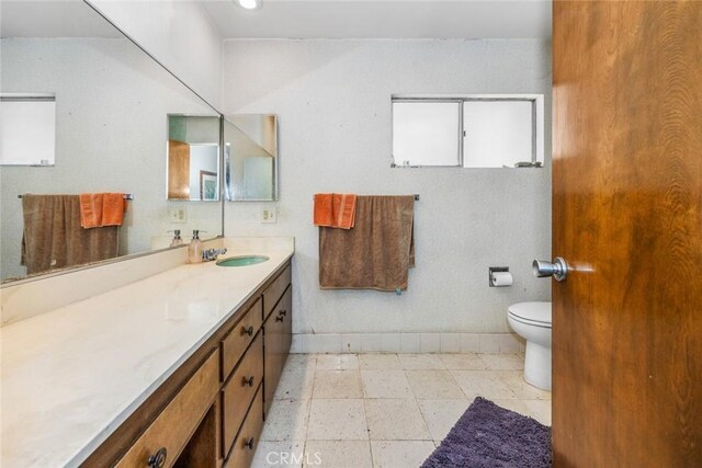 7160 Bel Air St, Corona, CA 92881 - bathroom featuring baseboards, vanity, and toilet