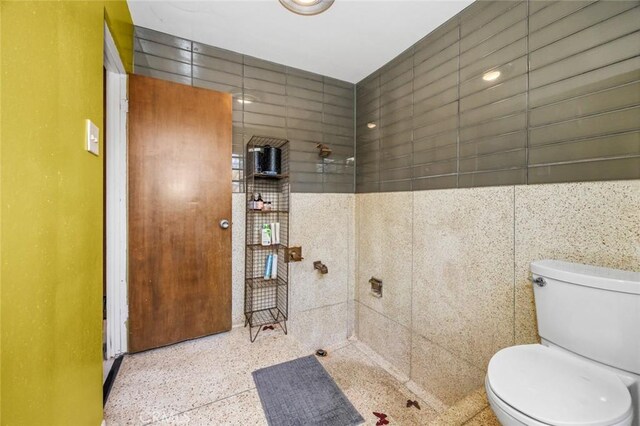 7160 Bel Air St, Corona, CA 92881 - bathroom with speckled floor, toilet, and tiled shower