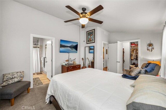 7160 Bel Air St, Corona, CA 92881 - bedroom featuring vaulted ceiling, a walk in closet, a closet, a ceiling fan, and ensuite bath