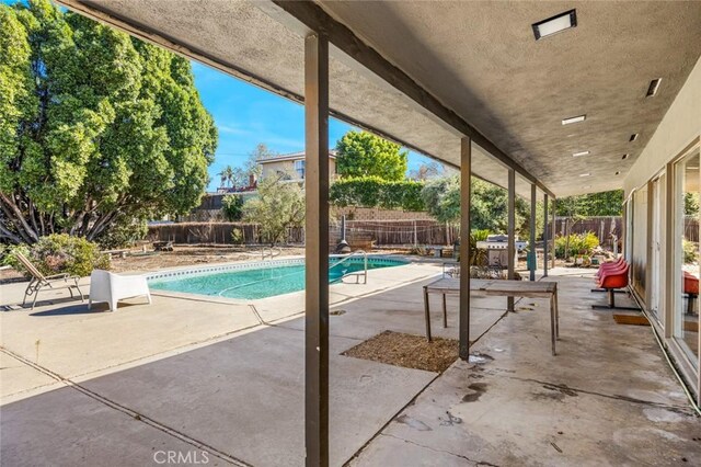 7160 Bel Air St, Corona, CA 92881 - view of swimming pool with a patio area and a fenced backyard