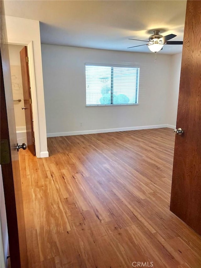 27535 Lakeview Dr Unit 14, Helendale, CA 92342 - spare room with light wood-type flooring, a ceiling fan, and baseboards