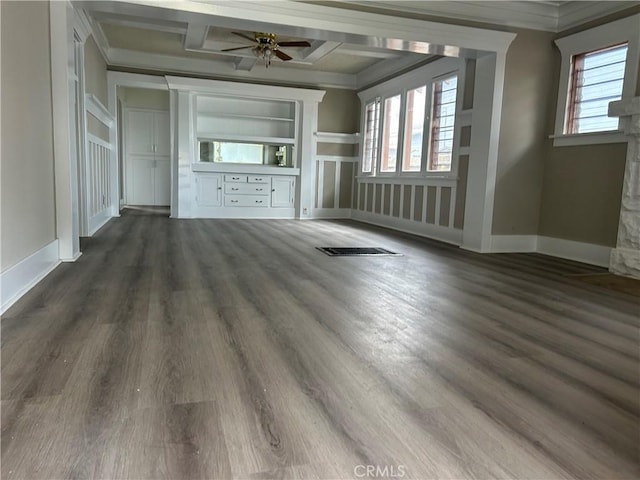 unfurnished living room with plenty of natural light, coffered ceiling, ornamental molding, and ceiling fan