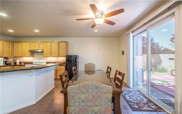 dining area featuring recessed lighting, dark tile patterned floors, baseboards, and ceiling fan
