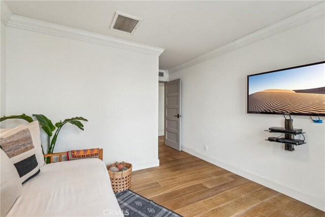 800 W 1st St Unit 1803, Los Angeles, CA 90012 - bedroom featuring crown molding, wood finished floors, and baseboards