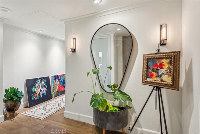 800 W 1st St Unit 1803, Los Angeles, CA 90012 - detailed view of crown molding, wood finished floors, baseboards, and recessed lighting