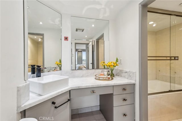 800 W 1st St Unit 1803, Los Angeles, CA 90012 - bathroom with vanity, bath / shower combo with glass door, and recessed lighting