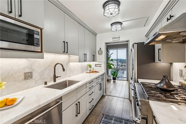 800 W 1st St Unit 1803, Los Angeles, CA 90012 - kitchen with a sink, appliances with stainless steel finishes, backsplash, dark wood-style floors, and under cabinet range hood