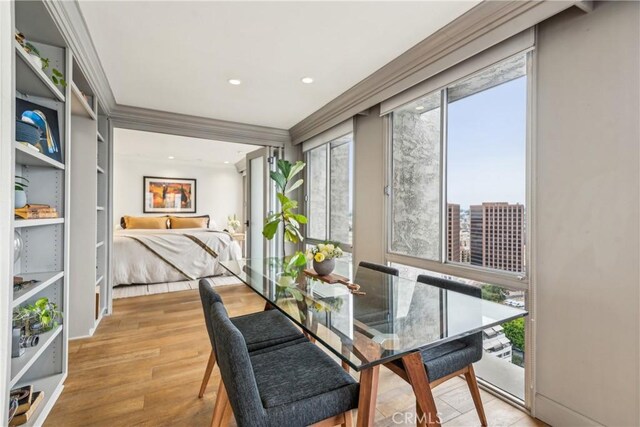 800 W 1st St Unit 1803, Los Angeles, CA 90012 - dining space with wood finished floors and crown molding