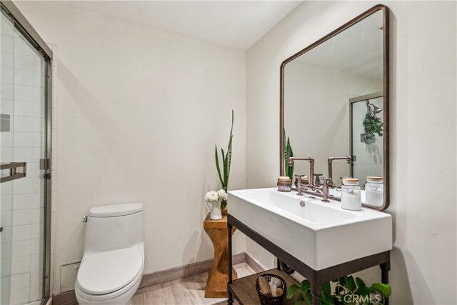 800 W 1st St Unit 1803, Los Angeles, CA 90012 - full bath featuring toilet, wood finished floors, and tiled shower