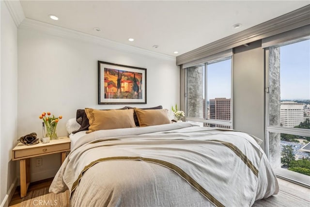 800 W 1st St Unit 1803, Los Angeles, CA 90012 - bedroom with multiple windows, wood finished floors, crown molding, recessed lighting, and baseboards
