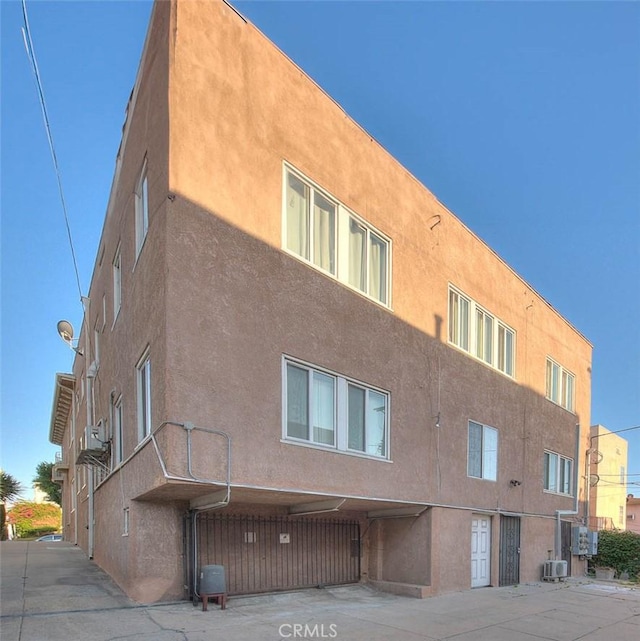 view of building exterior with central air condition unit