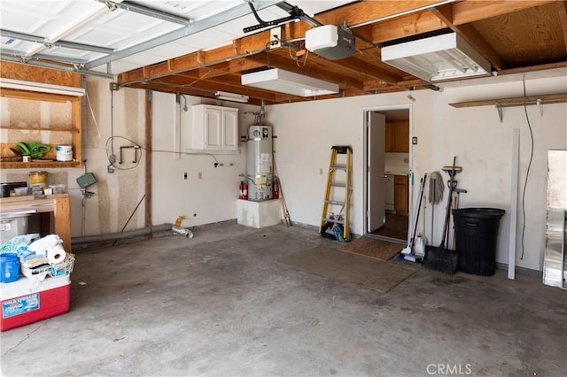 garage featuring a garage door opener and strapped water heater