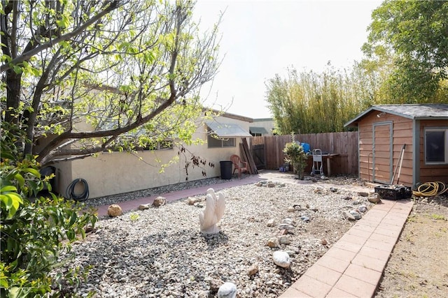 view of yard featuring an outbuilding and a fenced backyard