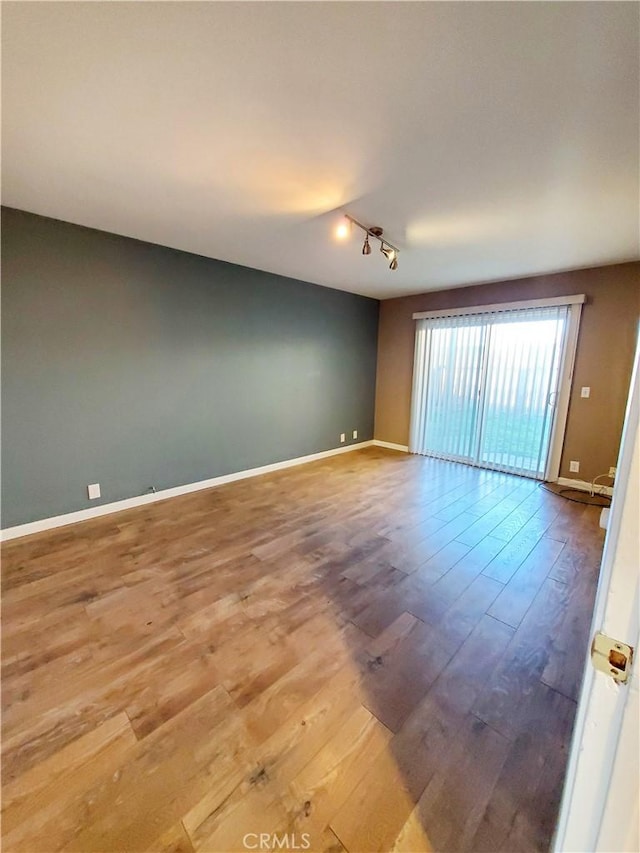 327 Mccarthy Ave, Oceano, CA 93445 - spare room with wood finished floors, rail lighting, and baseboards