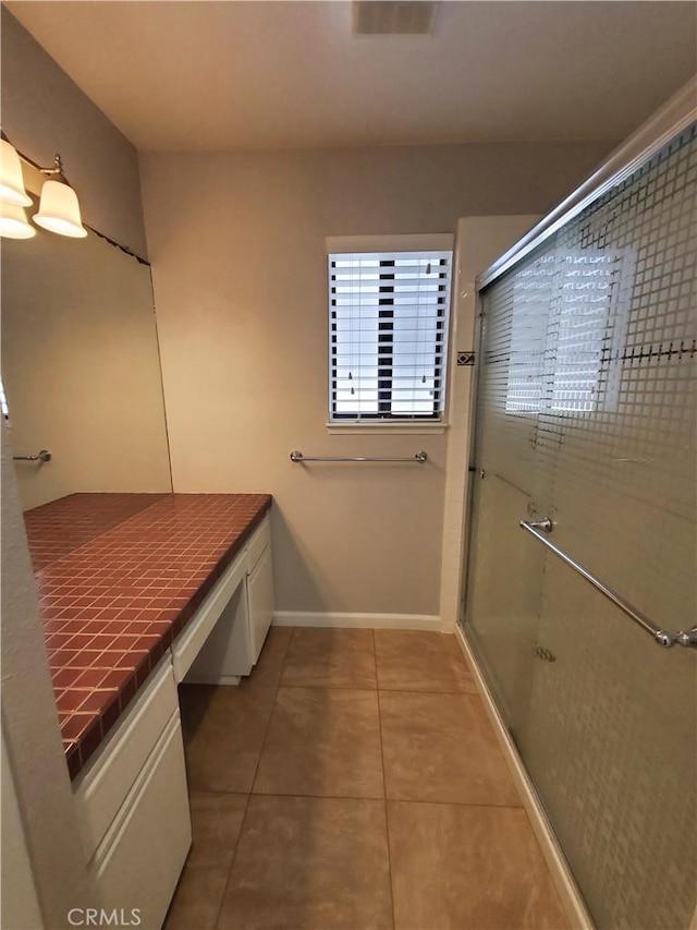 327 Mccarthy Ave, Oceano, CA 93445 - full bath with tile patterned floors, a shower stall, vanity, and baseboards
