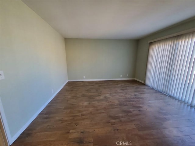 327 Mccarthy Ave, Oceano, CA 93445 - empty room with dark wood-style flooring, baseboards, and plenty of natural light