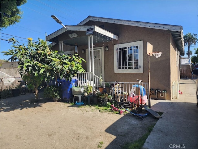 242 E 92nd St, Los Angeles, CA 90003 - back of property with stucco siding