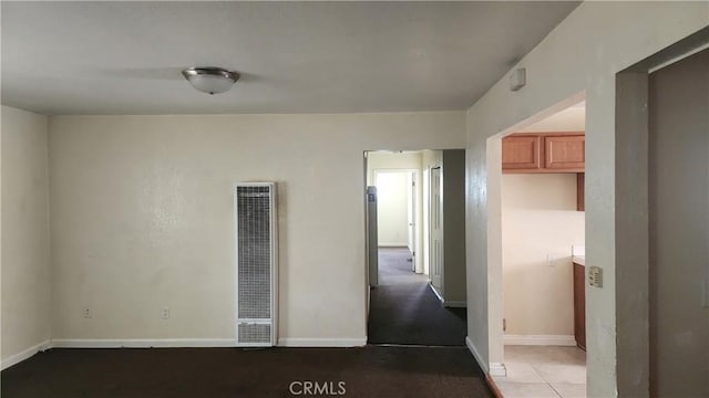 242 E 92nd St, Los Angeles, CA 90003 - unfurnished room featuring a heating unit and baseboards