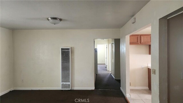 242 E 92nd St, Los Angeles, CA 90003 - unfurnished room with a heating unit and baseboards