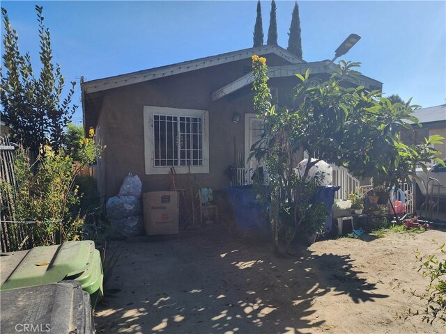 242 E 92nd St, Los Angeles, CA 90003 - view of side of home with stucco siding