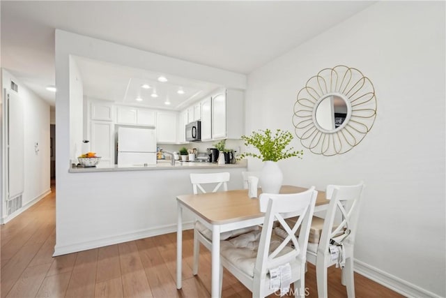22230 S Vermont Ave Unit 102B, Torrance, CA 90502 - dining area with recessed lighting and wood finished floors