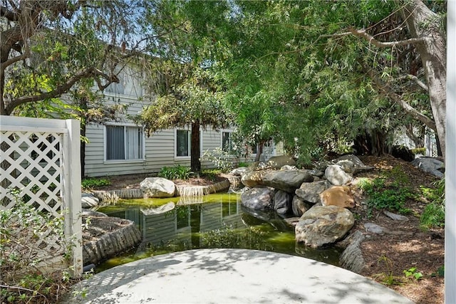 22230 S Vermont Ave Unit 102B, Torrance, CA 90502 - view of yard featuring a garden pond