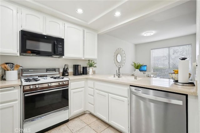 22230 S Vermont Ave Unit 102B, Torrance, CA 90502 - kitchen with white range with gas stovetop, black microwave, dishwasher, light tile patterned floors, and white cabinets