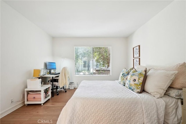 22230 S Vermont Ave Unit 102B, Torrance, CA 90502 - bedroom with wood finished floors and an office area