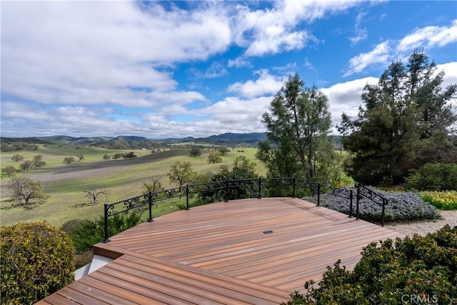 wooden deck featuring a mountain view