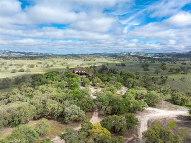 drone / aerial view featuring a mountain view and a rural view