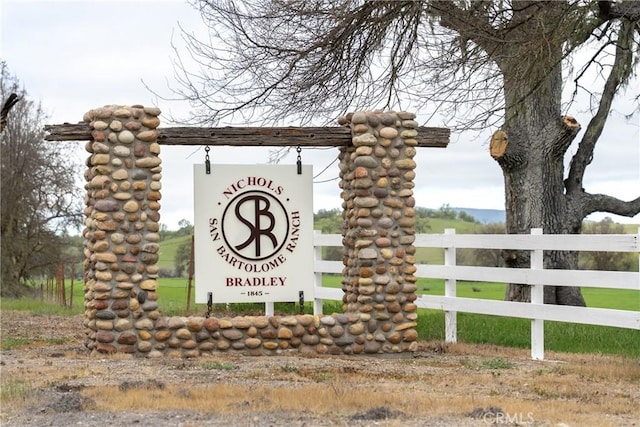 community sign featuring fence