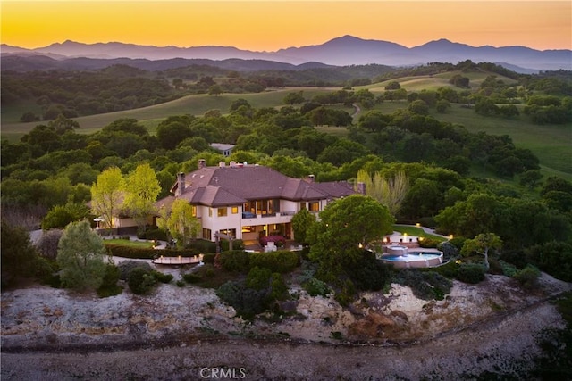 drone / aerial view featuring a mountain view